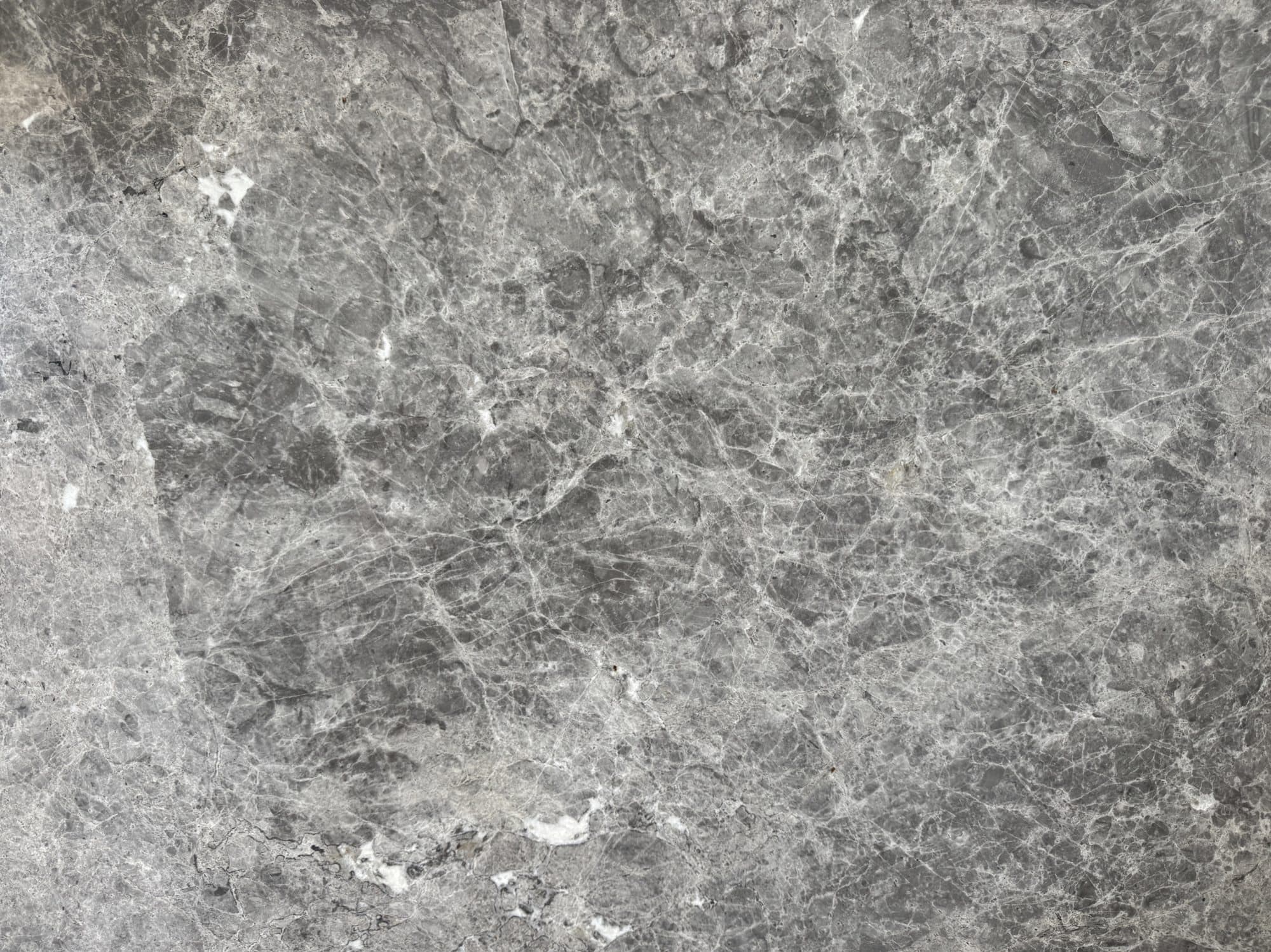 Tundra Grey Pulido — Mármol · Nuevo Horizonte Marmolería